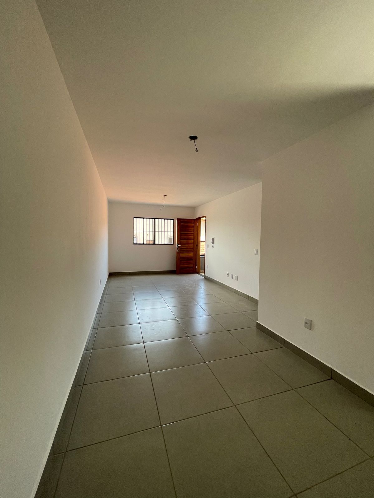 Sala integrada com cozinha americana