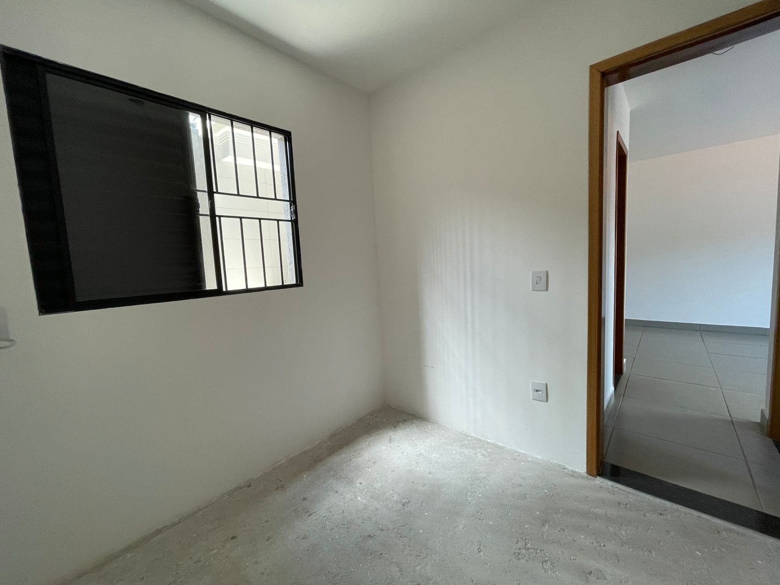 Sala integrada com cozinha americana